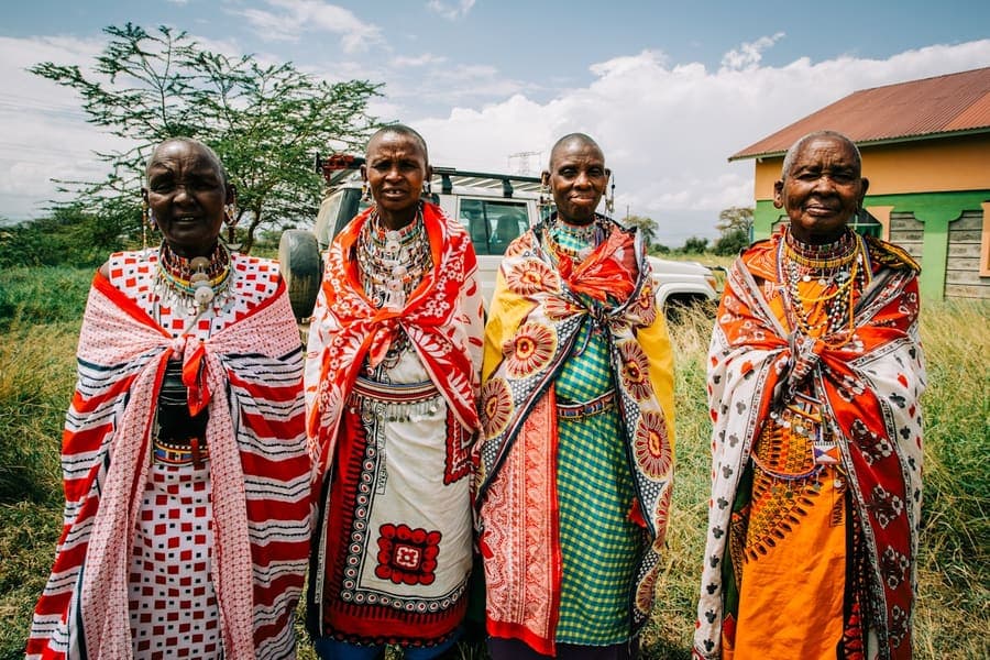 Maasai guide walking across open conservancy land in Kenya